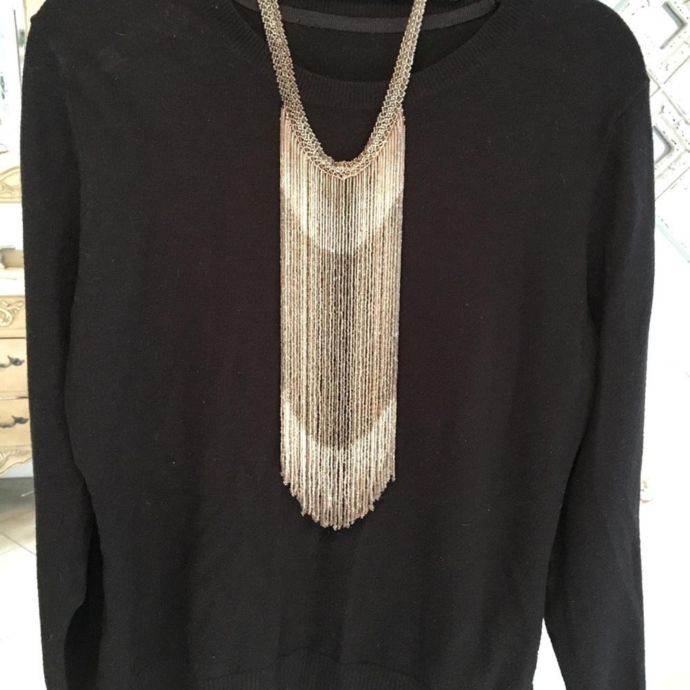 Potay bead necklace.  Has four closures so you can wear at different lengths.